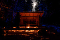 Full moon and campfire shelter