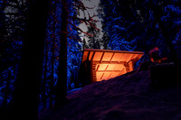 Full moon and campfire shelter