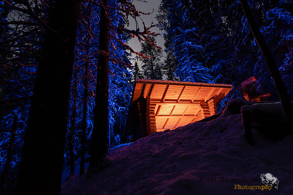Full moon and campfire shelter