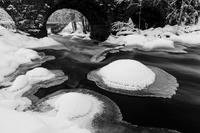 Ice caps under stone bridge
