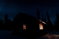 Wilderness cabin and night sky