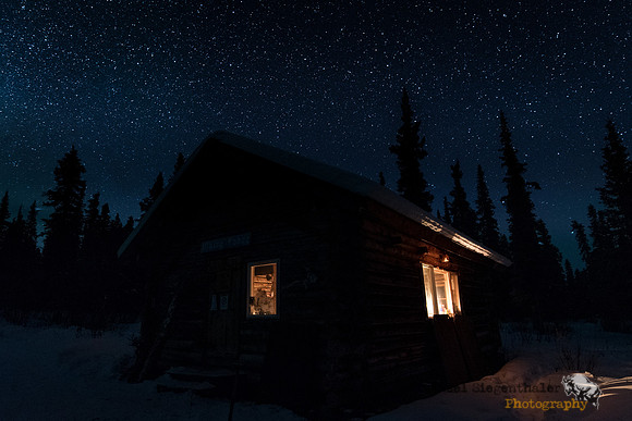 Wilderness cabin and night sky
