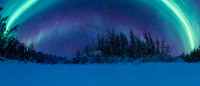 Aurora arc over frozen river