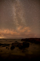 Milky Way on on the coast with windblown clouds