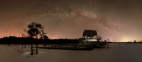 Milky Way over bird watching tower in winter
