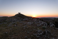 Watchtower at sunset on mountain summit