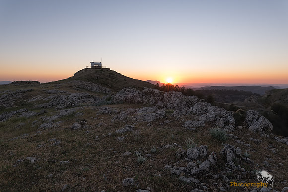 Watchtower at sunset on mountain summit